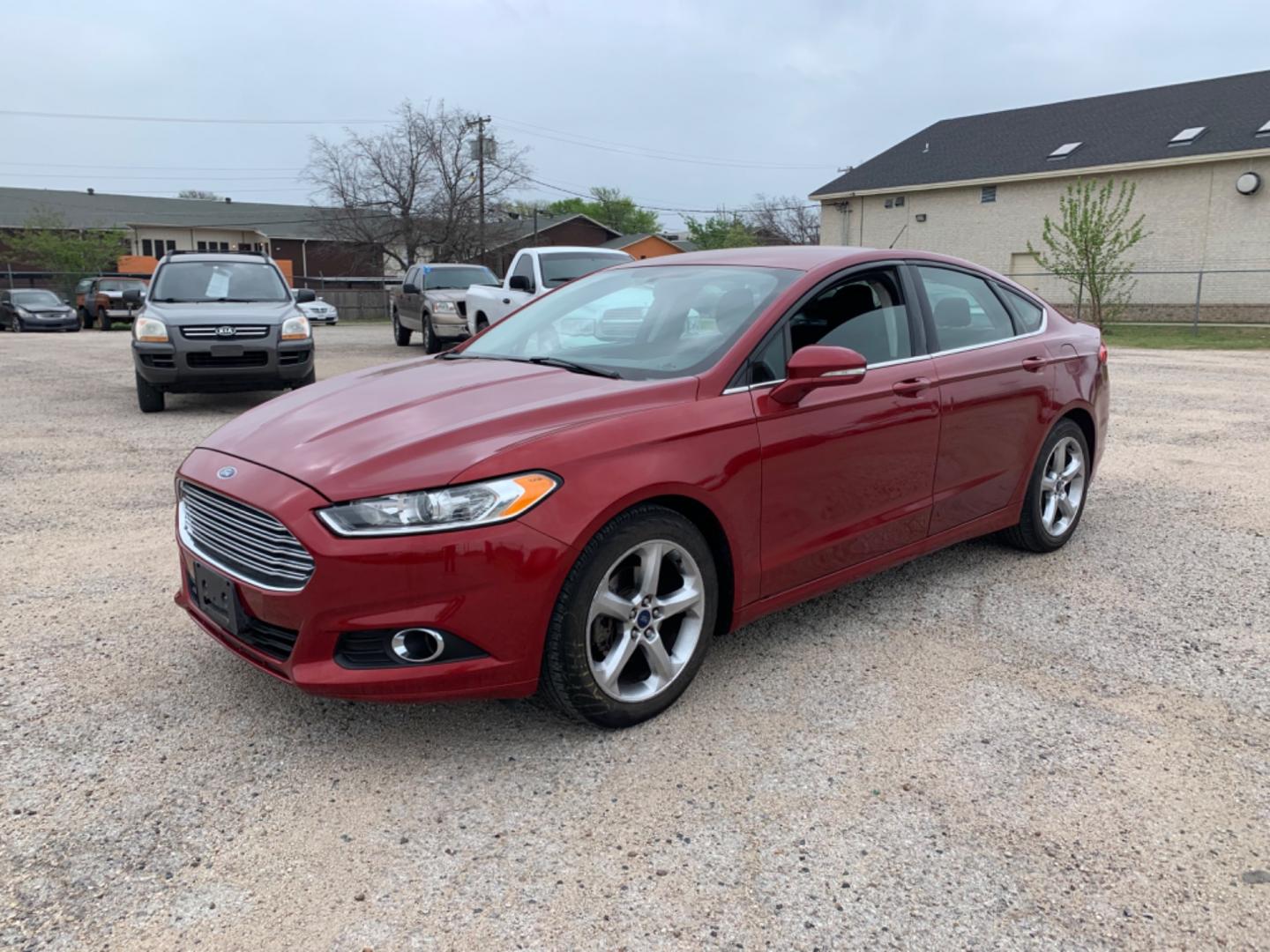 2015 Maroon /Black Ford Fusion SE (3FA6P0H95FR) with an 2.0L L4 DOHC 16V engine, Automatic transmission, located at 1830 North Belt Line Road, Irving, TX, 75061, (469) 524-0199, 32.834373, -96.993584 - Photo#0